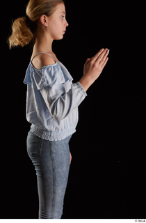 Sarah  1 arm blue blouse dressed flexing side view…